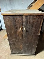 Closed cabinet showing exterior wear