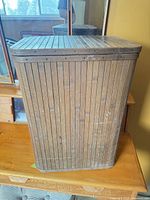 Full view of wooden slat hamper