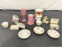 Full lot showing all miniature ceramics, trinket boxes, glass vase and figurine