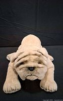 Front view of beige bulldog plush toy