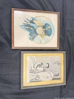 Front view of both framed prints showing artwork and condition