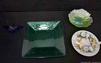 All four items: green glass tray, art glass bowl, Seymour Mann plate, acrylic suncatcher