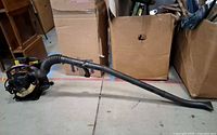 Full side view of Homelite backpack blower with long discharge tube