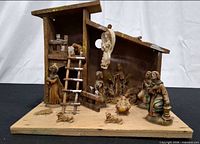 Full view of wooden stable with all nativity figures and accessories displayed