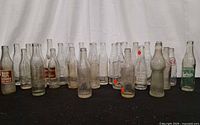 Group view of all vintage glass soda bottles