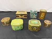 Group shot of all eight decorative metal boxes