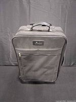 Front view showing Lucas badge, fabric texture, front zipper pocket