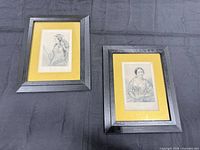 Front view showing both framed portraits