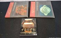 Front view of all three National Palace Museum art books