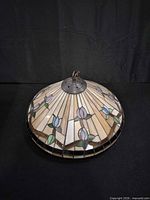 Side view of dome stained glass chandelier showing floral pattern