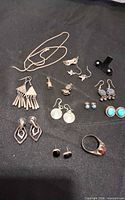 Group shot of all sterling jewellery items on black cloth