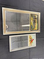 Front view showing both framed mirrors with printed panels