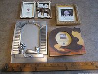 All four frames laid out with 12-inch ruler for scale