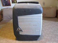 Projector with cover closed showing Tower branding