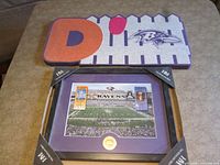 Foam D-Fence sign and framed print together
