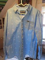 Front view of light blue Grateful Dead Section 119 button-down shirt with Dancing Bear pattern