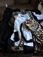 All garments and accessories laid out on table