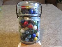 Jar filled with marbles, front view