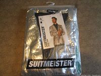 Factory-sealed package containing silver sequin blazer with Suitmeister branding visible