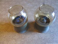 Front angled view of both oil lamps with globes in place