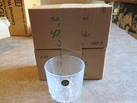 Single Princess House whiskey glass displaying cut pattern and brand sticker with original two-pack box behind