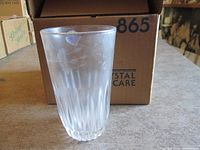 Single tumbler in front of original box showing model number 865