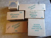 Stack of six Princess House boxes showing item numbers 872, 120, 495, 499, 481, 0837