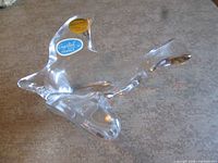 Left side view of clear crystal bird dish showing overall shape