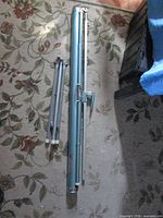 screen components collapsed: roller case and folded legs