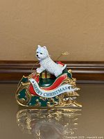 Front view showing Westie on sleigh with Merry Christmas banner
