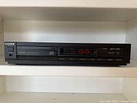 Front view Magnavox CDB482 CD player on shelf