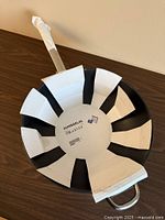 Top view showing non-stick interior, cardboard insert, handle wrap