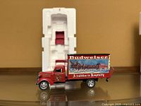 Truck beside original Styrofoam clamshell packaging