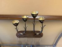 Full view of candelabra showing four tulip cups and base