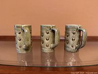 front view of three Nelson studio pottery mugs
