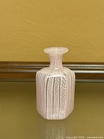 Front view of pink filigree latticino Murano vase