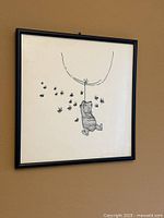 Full view of framed square illustration on wall