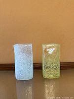 Front view of both rectangular fused glass vases, blue and green