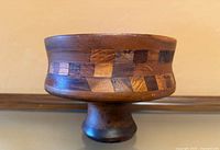 Side view showing full bowl and pedestal base