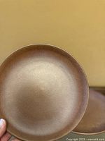 Front view of brown stoneware dinner plate