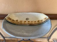 Top view of oval stoneware bowl showing interior glaze and decorative band