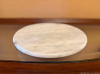 Top view of round white/gray marble tray