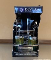 Front of boxed Devella 15 piece flatware set showing caddy with salt and pepper shakers