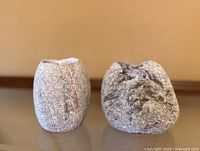Front view of two granite candlestick holders