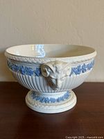 Front view of Wedgwood footed bowl showing rams head and blue relief garland