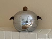 Full view of stainless steel penguin ice bucket with lid and wood finial