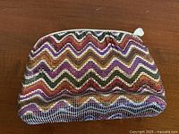 Front view of multicolor chevron mesh purse