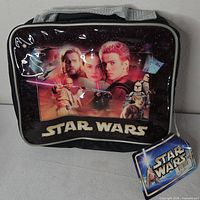 Front of lunch bag showing Star Wars graphic and hang tag