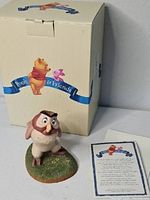 Owl figurine in front of Pooh & Friends box with certificate card