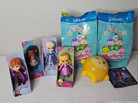 Group shot showing all eight new, packaged Disney and Squishmallows items